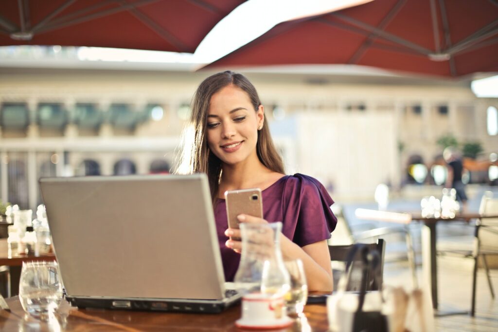 Girl on phone/laptop