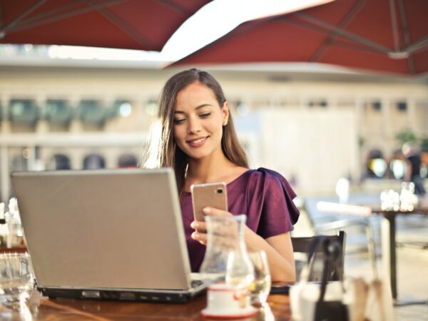 Girl on phone/laptop