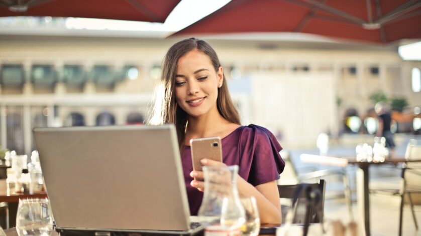 Girl on phone/laptop